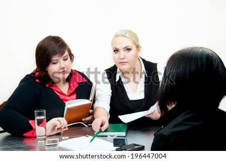 Beautiful business woman sharing ideas with each other. Shot in the studio against an isolated white background.
