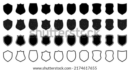 Set of various vintage outlined shield icons. Black heraldic shields with grunge texture. Protection and security symbol, label. Vector illustration.