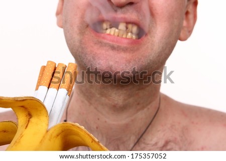 Cigarettes in a banana, smoker, bad teeth