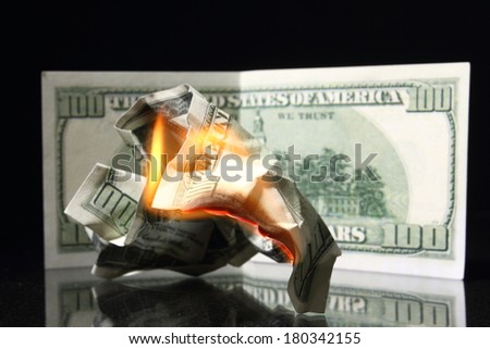money, One hundred dollars in fire, burning dollar, ashes