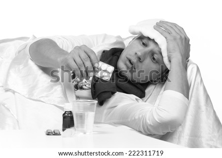 Sick man. Flu. Caught. Cold. Sneezing into Tissue. Headache. Virus .Medicines