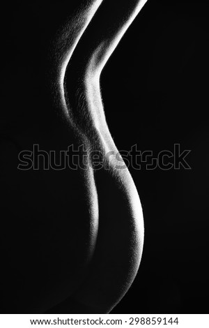 Sexy body nude woman buttocks. Naked sensual beautiful back. Black and white artistic photo. classic low key