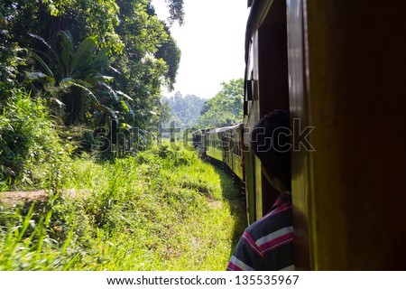 riding by train the scenic mountain track from Kandy to Colombo