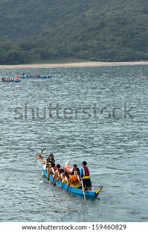 HONG KONG, CHINA - OCT 19: Dragon boat race in Hong Kong University of Science and Technology (HKUST) in Hong Kong, China on Oct 19, 2013. This event was organized by HKUST water sport center.