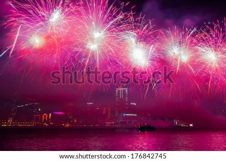HONG KONG - FEB 02, 2014: Lunar New Year Fireworks along Victoria Harbor in Hong Kong. This is an annual event in Chinese New Year.