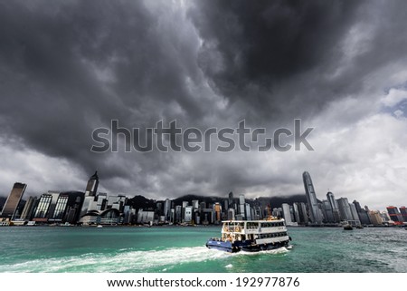HONG KONG - MAY 15, 2014: View of Victoria harbor just before a tropical cyclone. During summer, typhoons regularly skirt the city, causing varying degrees of damage including injuries and deaths.