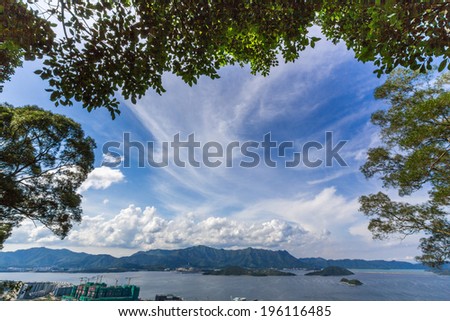Beautiful Summer Day in Tolo Harbor Area next to the Chinese University of Hong Kong. Tsz Shan Monastery is located on these mountains.
