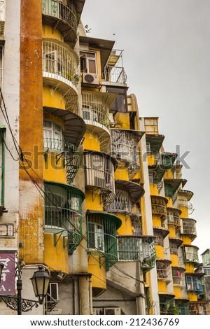 MACAU - JUNE 6, 2014:  Apartments in Macao. Macao is developing fast, but still the majority of the people live in harsh conditions. Poor quarters are around the town.
