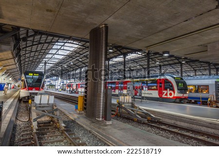 LUCERNE, SWITZERLAND - SEP 16, 2014: Lucern central train station. Due to its location on the shore of Lake Lucerne within sight of Swiss Alps, Lucerne has long been a destination for tourists.