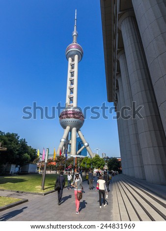 SHANGHAI, CHINA - OCT 24, 2014: The Oriental Pearl is a TV tower in Shanghai, China. It is located at the tip of Lujiazui in the Pudong district by the side of Huangpu River, opposite The Bund.