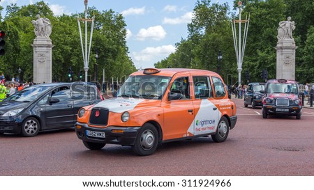 LONDON, UK - JULY 21, 2015: Traditional London Taxis in London, England. They are one of the world famous symbols of London.