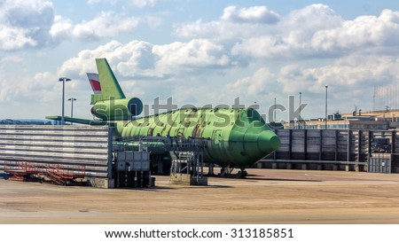 LONDON, UK - JULY 25, 2015: An aircraft fire trainer at London Heathrow Airport. It is used by the airport fire crew to practice putting out fires and rescuing people from burning aircraft.