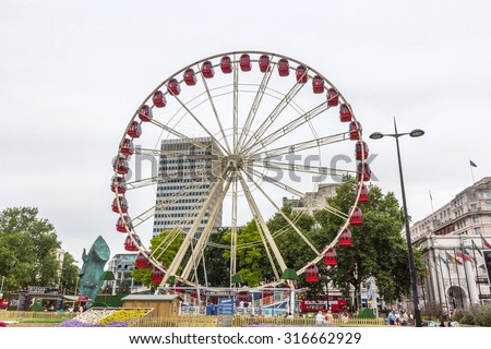 LONDON, UK - JULY 22, 2015: The Marble Arch Observation Wheel in London, England. It has 36 enclosed, weather-proof pods, each seating six people, and showing views of London.