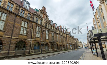 CAMBRIDGE, UK - JULY 24, 2015: Downing Street of Cambridge, England. It runs between Pembroke Street & Tennis Court Road at the western end and a T-junction with St Andrew\'s Street at the eastern end.