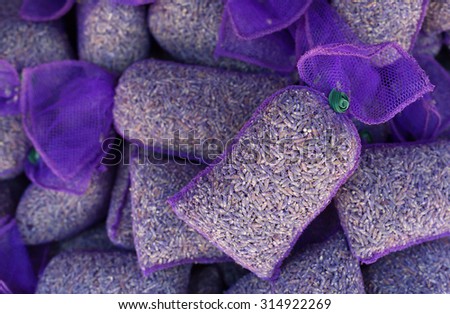 Aromatic pouch with lavandula flowers. Lavender flowers in purple mesh pouches in order to provide an aromatic sachet. Photographed in Provence region.