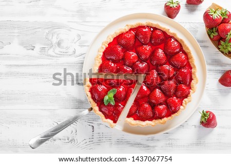 Delicious strawberry tart on white wooden background, top view Stok fotoğraf © 