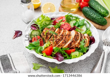 Grilled chicken breast, fillet and fresh vegetable salad. Healthy lunch menu. Stock foto © 