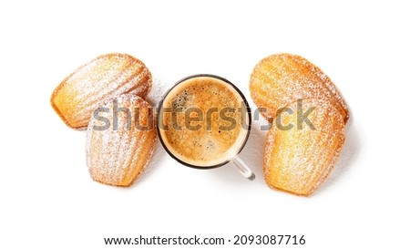 Perfect French madeleine cookies, buttery and delicate, powdered with icing sugar served with cup of coffee. Isolated on white background. Top view Photo stock © 