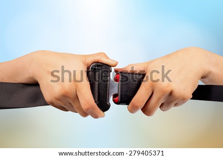 close up two hand use safety belt on colorful blurred background,safety concept and clipping path