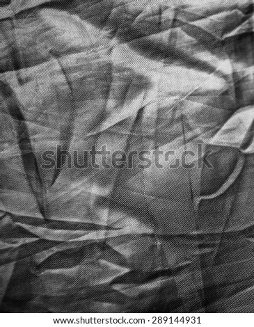 crumpled black shade cloth