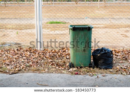Green bin , Black garbage bags , garbage bags and trashcan , Trash fence
