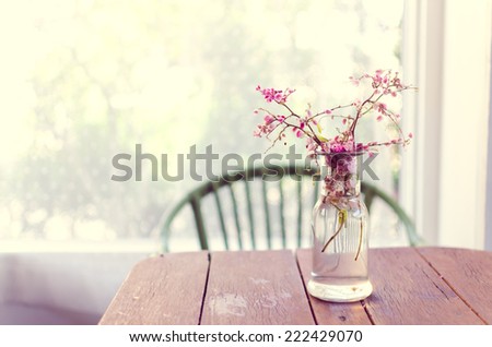 Vase of pink flowers on the table
