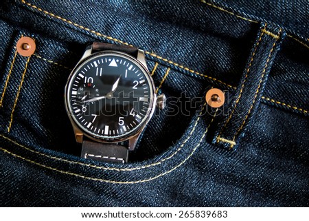 Wristwatch in jeans pocket , Time in jeans pocket