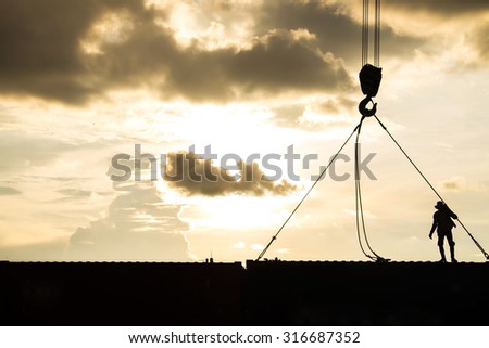 Silhouette of container crane with people working , lifestyle work