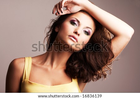 Fashion girl posing on light background