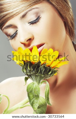 Beautiful woman with a sunflower