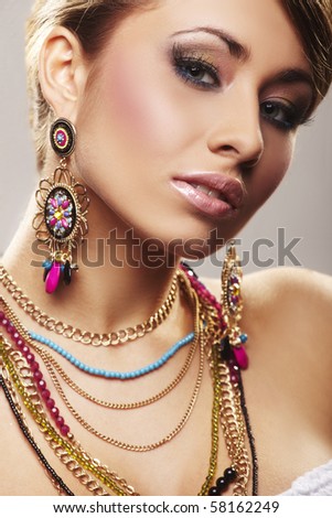 fashion woman with jewelry on light bacground