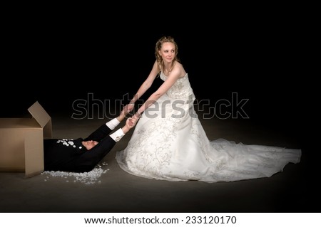 Bride getting a brand new husband out of a box