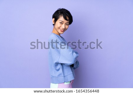 Similar – Image, Stock Photo Lateral portrait of a young woman in front of a red wall