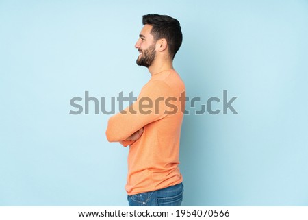 Similar – Image, Stock Photo Lateral portrait of a young woman in front of a red wall