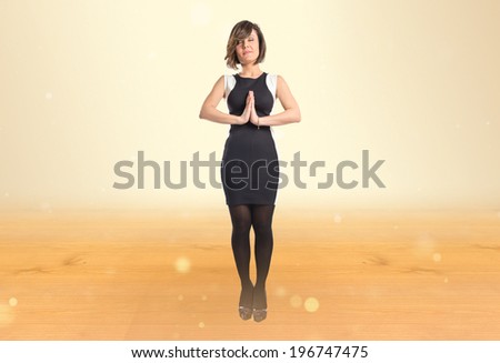 Zen woman over ocher background