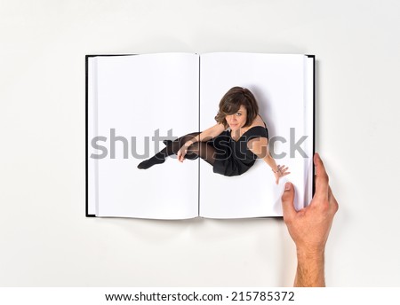 Pretty brunette woman sitting on the floor printed on book
