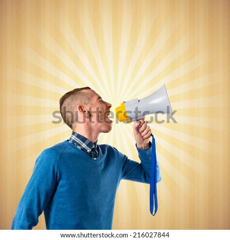 Redhead man shouting by megaphone over pop background