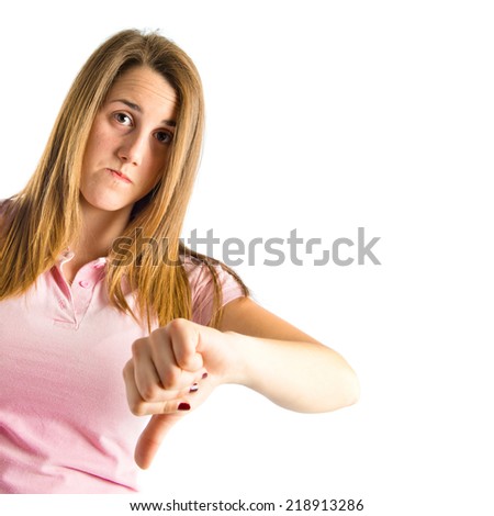 Blonde girl making a good-bad sign over white background