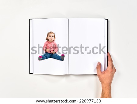 Cute baby girl sticking out tongue printed on book