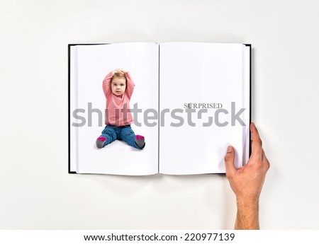 Cute baby girl surprised printed on book