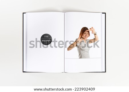 Young girl focusing with her fingers printed on book