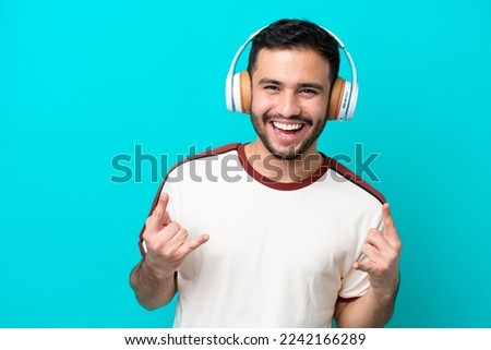 Similar – Image, Stock Photo Latin man listening to music with earphones.