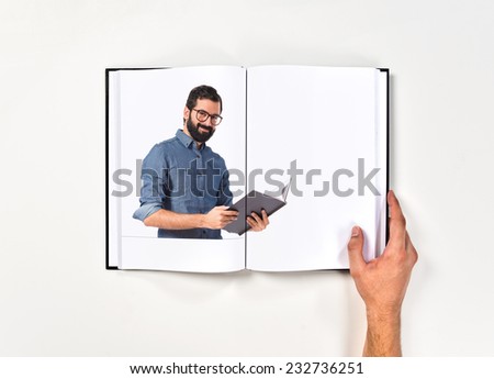 Happy hipster man reading a book printed on book