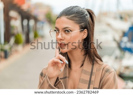 Similar – Image, Stock Photo Pretty woman with glasses portrait with christmas tree in background