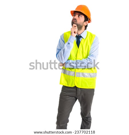 Worker thinking over white background