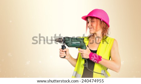 Worker woman with drill over ocher background