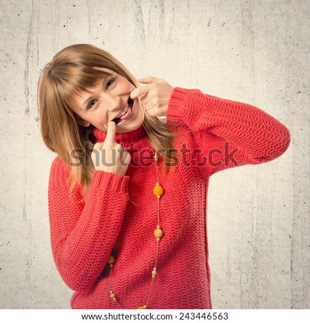 Cute young girl over textured background.