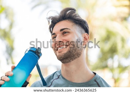 Image, Stock Photo Young hispanic men doing acrobatics near to a pink wall on the street