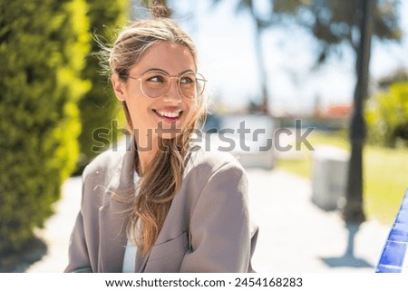 Similar – Image, Stock Photo Pretty woman with glasses portrait with christmas tree in background