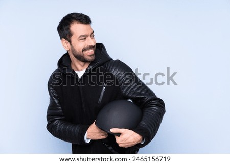 Similar – Image, Stock Photo Man in motorcycle looking at camera